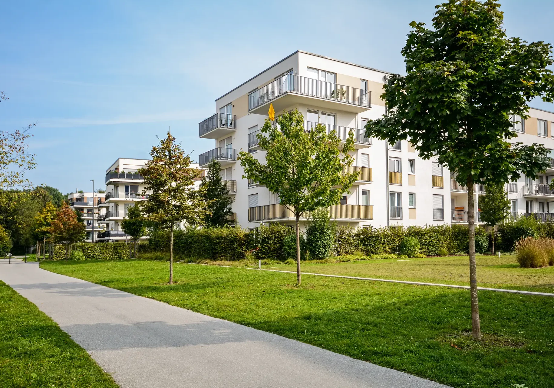 New apartment building - modern residential development in a green urban settlement